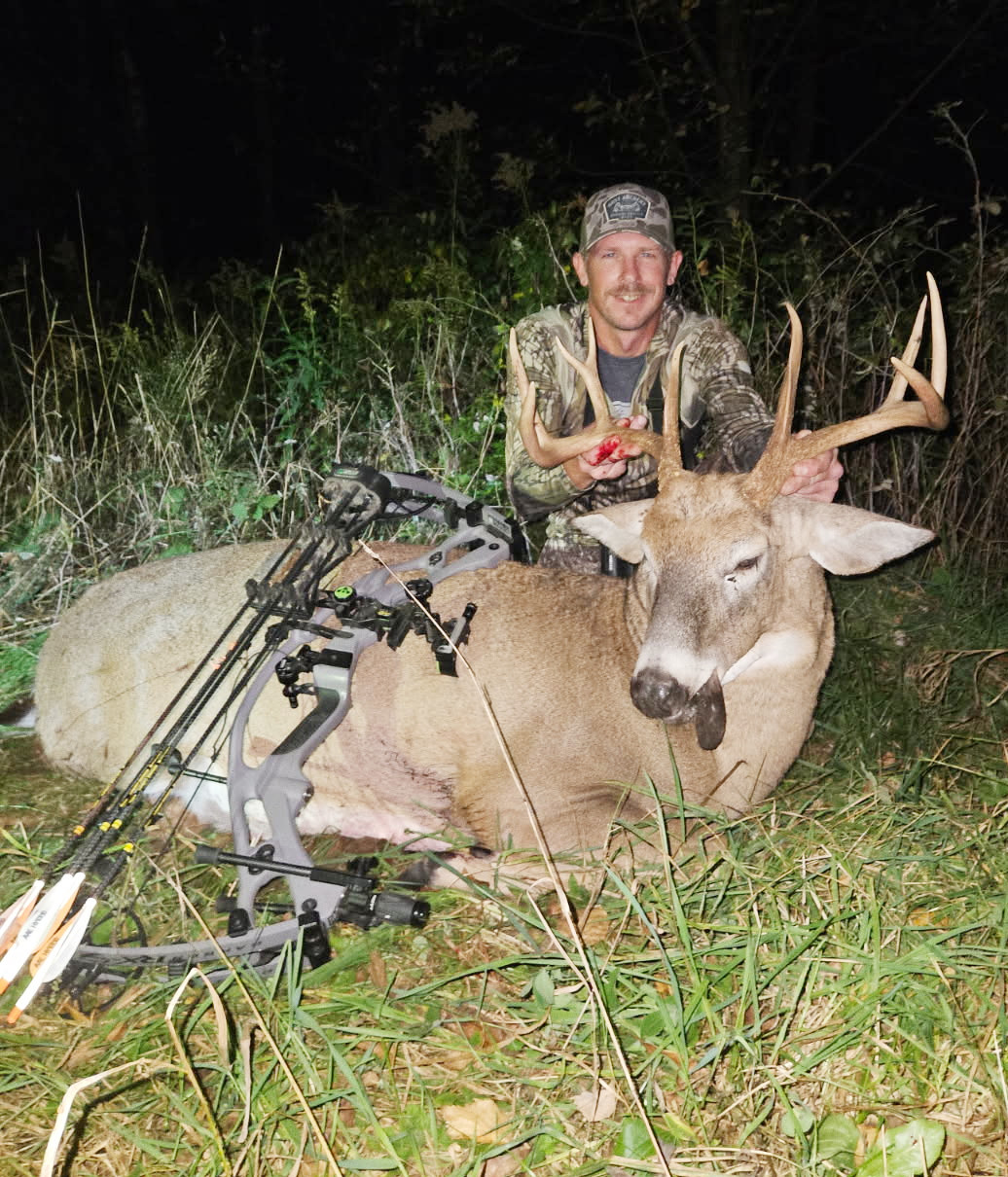 image of nate with 10 pointer he shot with bow